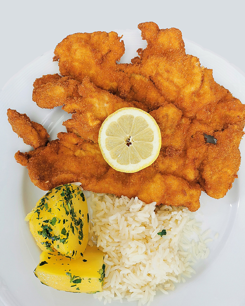 Wiener Schnitzel mit Reis und Kartoffeln als Beispiel
