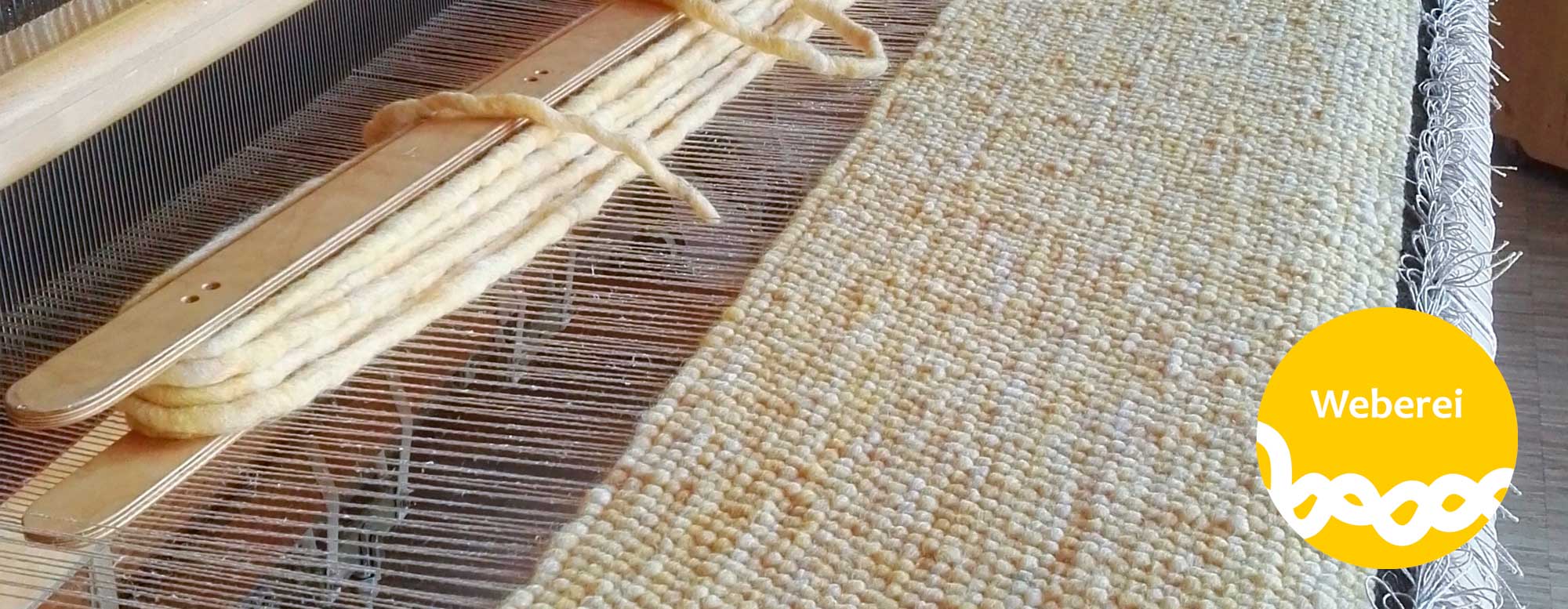 Webrahmen mit Schurwollteppich in Arbeit